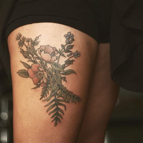 flower tattoo designs thigh